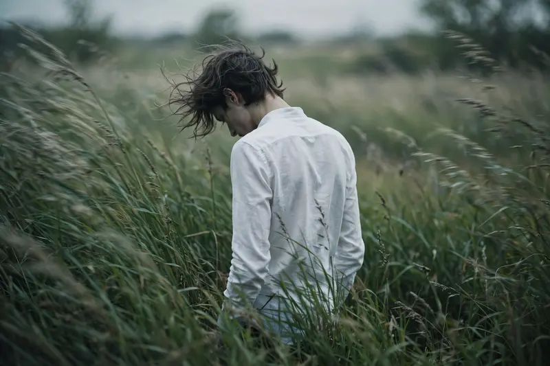 Man in Tall Grass, Seen from Behind